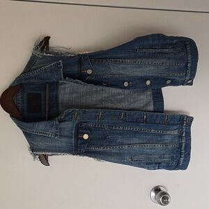 Blank NYC distressed denim vest. Sleeveless.